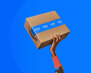 Hand holding an Amazon box