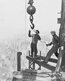 1931 photo Two iron workers straddle steel girders on top of the Empire State e8