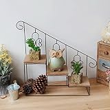 レトロなノスタルジックな鉄の装飾的な花のスタンド写真の小道具
