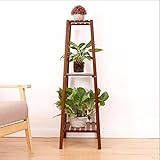 リビングルームのバルコニーは、3プライの木製の植木鉢スタンドです
