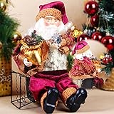 クリスマスのサンタクロースの人形の家のクリスマス飾りの装飾のギフトの座っている